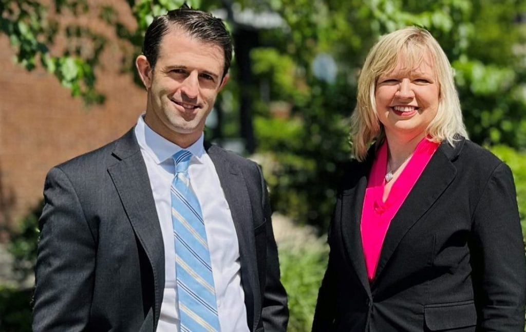 Bloomington Illinois family law attorneys Dustin Koth and Kristin Nieminksi repersenting client in McLean county divorce case