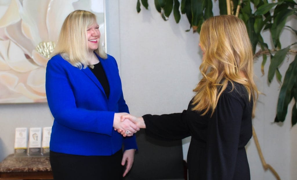 Attorney Kristin Nieminski from Koth Gregory & Nieminski Law Firm Bloomington, IL meeting with a divorce client