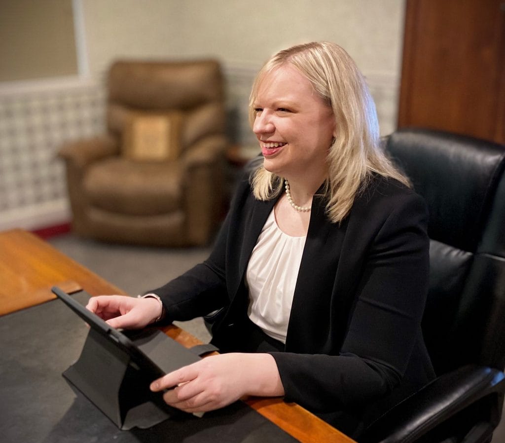 Bloomington-Normal family law attorney Kristin Nieminski explaining to a client about modifying maintence at Koth Gregory & Nieminski Law Firm consultation appointment. 