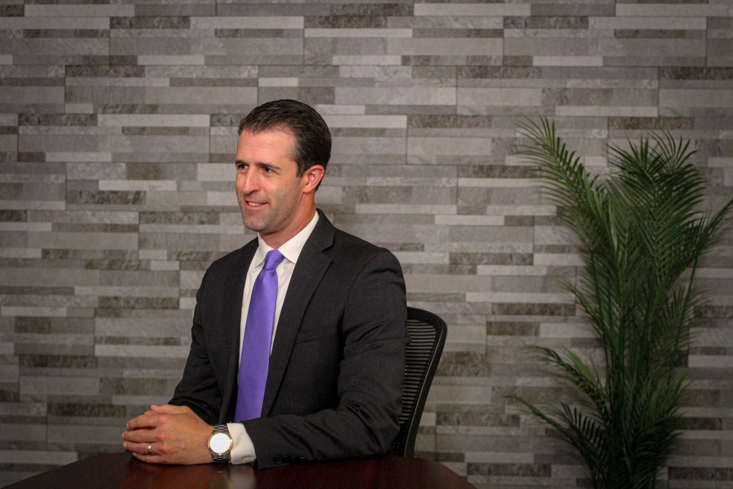 Personal injury attorney Dustin Koth taking notes during a car accident personal injury consulation about mistakes to avoid after an accident