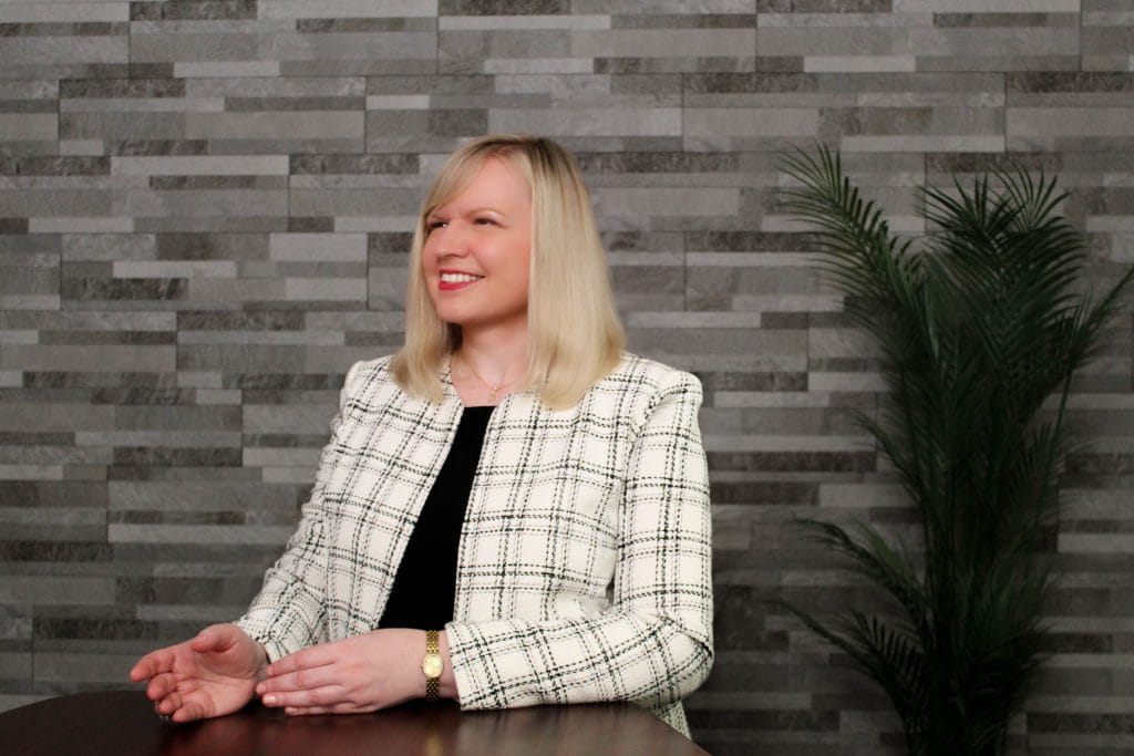 Experienced Illinois divorce attorney explaining how to terminate spousal maintenance or alimony under Illinois law during a client consultation in Bloomington, IL.