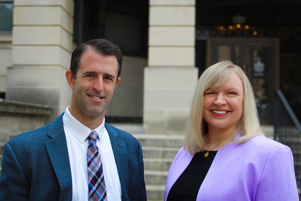 Bloomington-Normal family law attorneys Dustin Koth and Kristin Nieminski from Koth Gregory & Nieminski Law Firm, outside of McLean County Courthouse discussing Temporary Maintenance During Divorce
